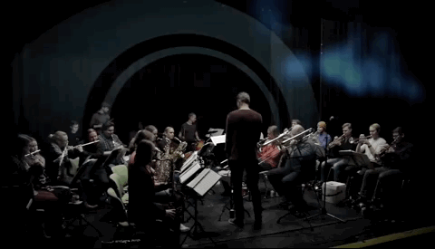 Short clip of the concept. An orchestra is seen with bright colours, visualising the music that is made